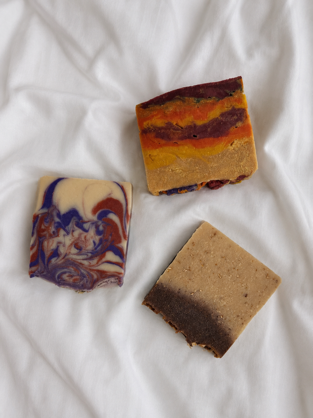 Tallow Soap scented an color sideways; smell the woods, honey oatmeal, and narcissist tallow soaps